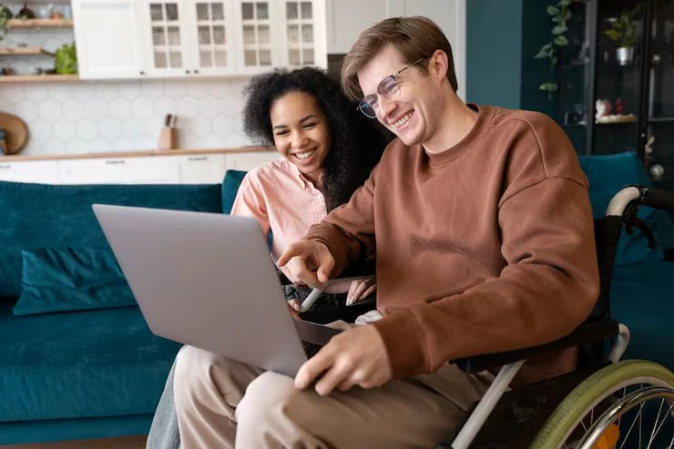 NDIS provider website shown on a laptop